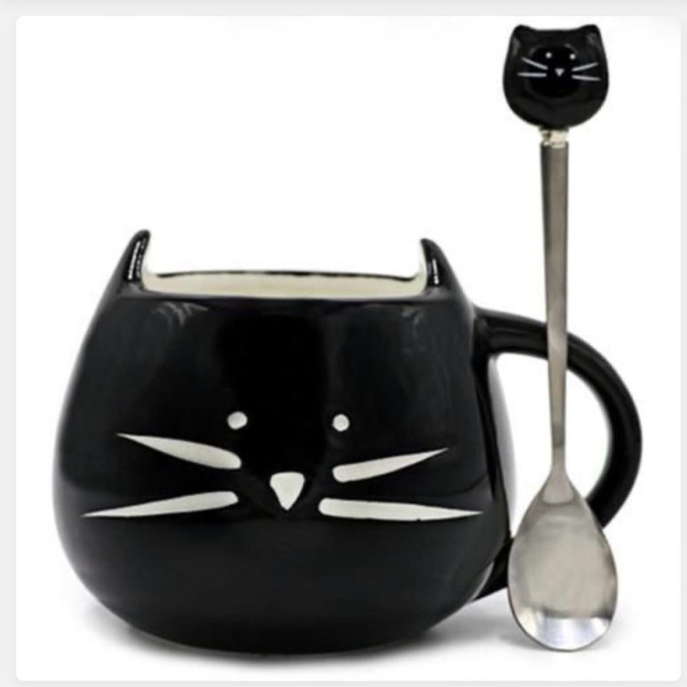 Black and white ceramic coffee or tea with matching spoon